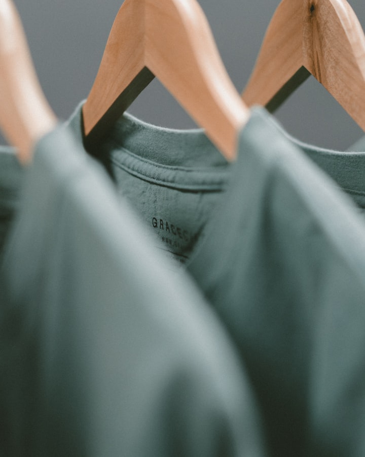 Clothing items folded in a lifestyle flatlay scene