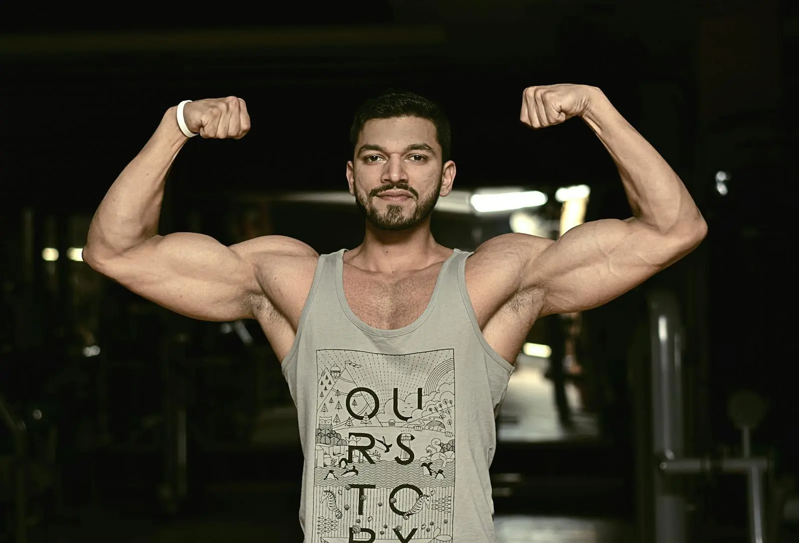 Athlete flexing toned muscles after a gym session