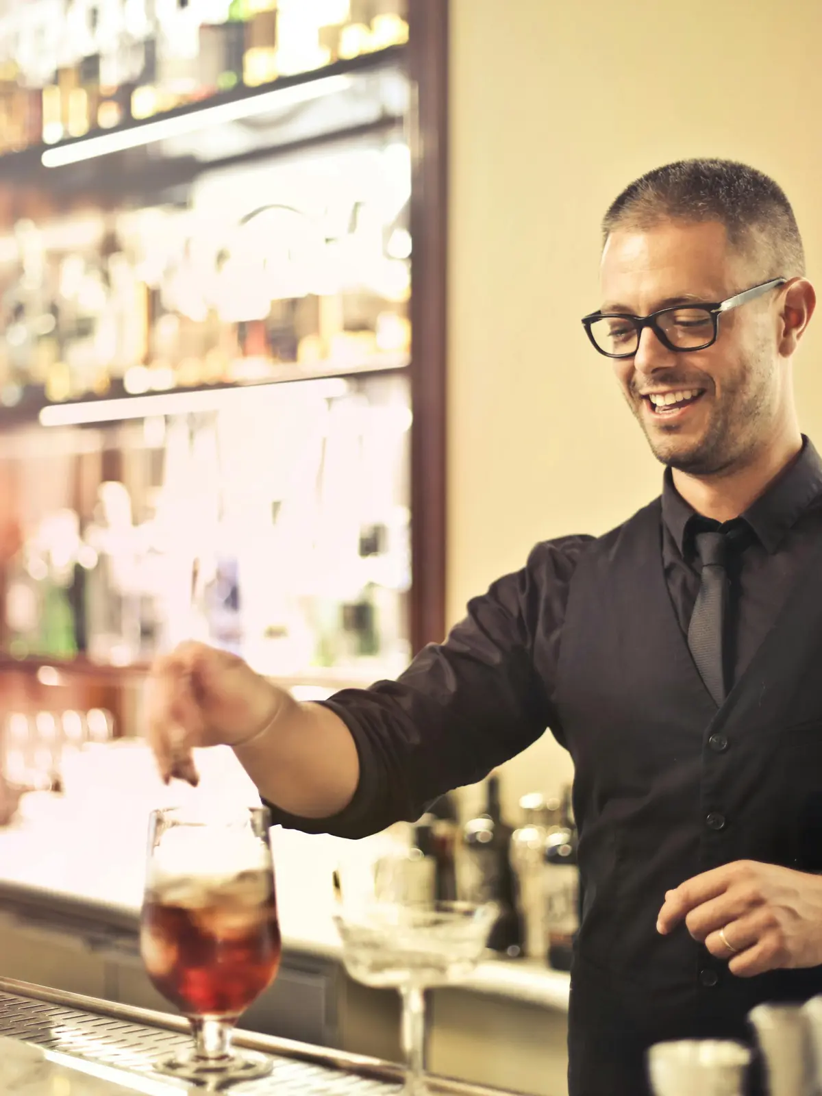 Boutique hotel concierge welcoming guests at the front desk