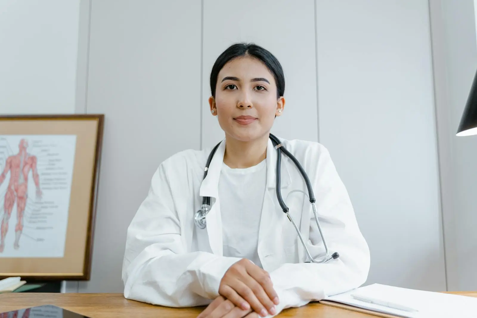 Clinician demonstrating medtech device during consultation